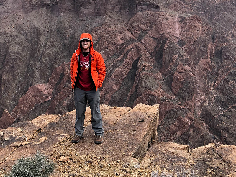 Student on mountain top
